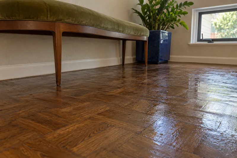 Water Extraction in Southlake — damp parquet below a bench after bulk water pickup